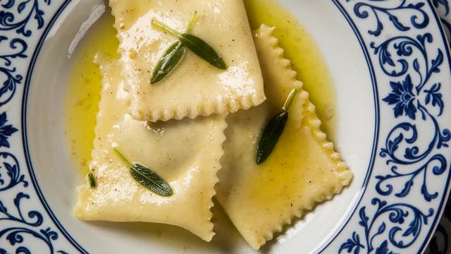 Tortellini with white sauce - Top view with smoke.