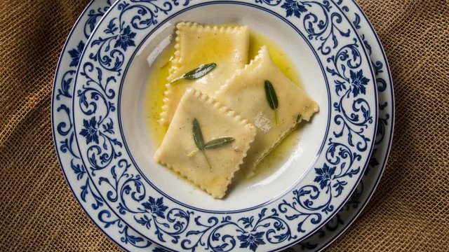 Tortellini with white sauce - Top view with smoke.