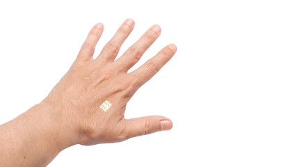 human hand holding a brush with an implanted microchip in the body for tracking and total control of the movement of the chipization plot, close-up isolated on a white background with copy space.