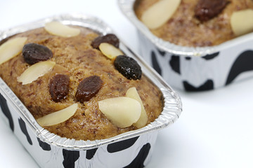 Banana cake with currants and almonds  isolate on white background