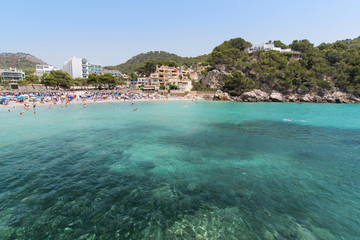 Fototapeta na wymiar Beach with people and sea landscape in Camp de Mar, Majorca