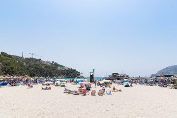 Fototapeta na wymiar Beach with people and sea landscape in Camp de Mar, Majorca