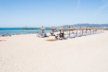 Fototapeta na wymiar Beach with people and sea landscape in Ciudad Jardin, Majorca