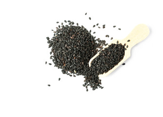 Black sesame seeds in wooden scoop isolated with white background.