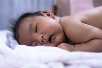 Fototapeta na wymiar Closeup face of Newborn baby sleeping