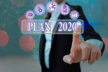 Conceptual hand writing showing Plan 2020. Concept meaning detailed proposal doing achieving...