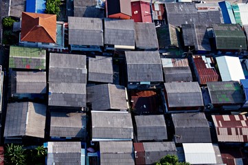 Top view of old abandoned house with rusted roof in Thailand.