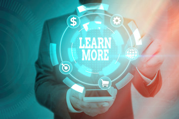 Word writing text Learn More. Business photo showcasing knowledge or skill acquired by instruction...