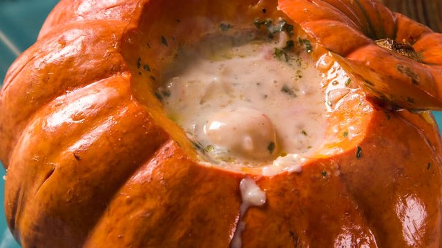 Prawns in Pumpkin (Camarao na Moranga) - Prawns with a creamy coconut milk sauce served inside a roasted pumpkin with smoke.