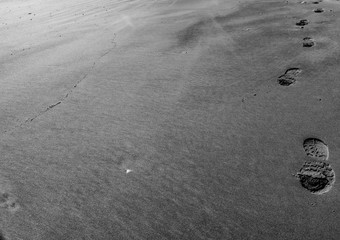 shoe prints in the sand.