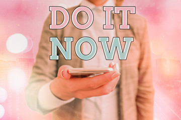 Conceptual hand writing showing Do It Now. Concept meaning not hesitate and start working or doing...