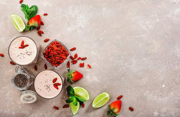 Healthy blended drink. Organic vegan non dairy smoothie with strawberry and goji berries, chia...