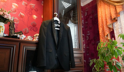 Men's black jacket on a wedding day.