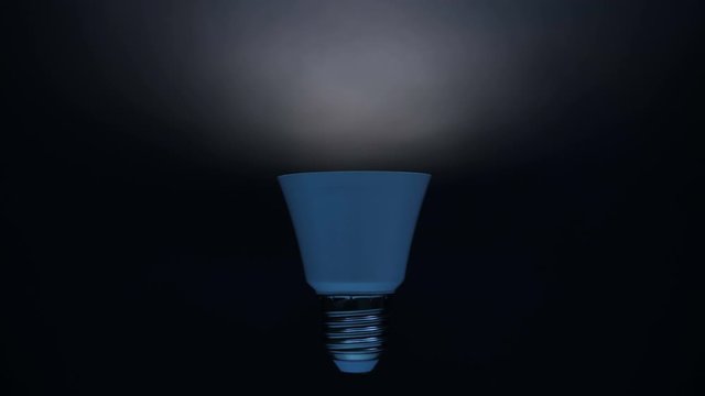 Energy-saving, eco-friendly Led bulb lamp lights up on a black background. You can see the structure of the led lamp. Closeup
