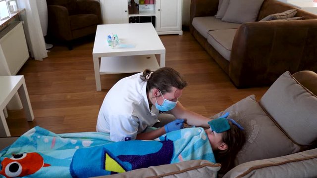 Home care nurse treating child at home