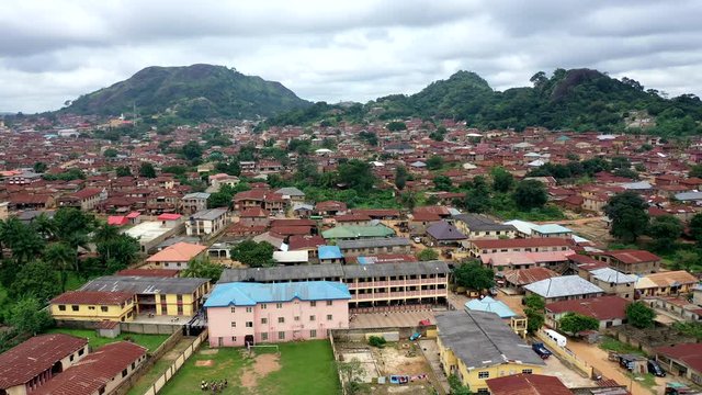 Buildings, school and homes in the town of Ikare-Akoko in the Ondo State of Nigeria - aerial view