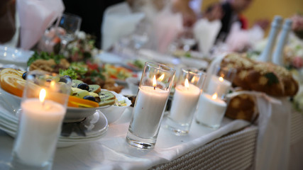 Obraz na płótnie Canvas Wedding with food and candles.