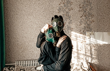 Couple hugs with gas mask. Stay home with mask and be in love because coronavirus epidemic