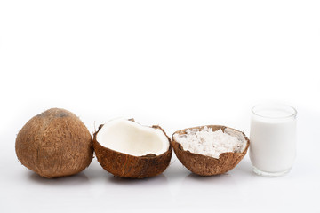 Coconut and a glass of coconut milk isolatd on white background. Healthy food.