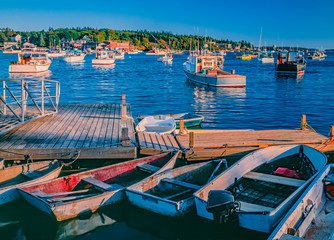 Fototapeta na wymiar Fishing village Bass Harbor is warmly lit in the last part of the day.