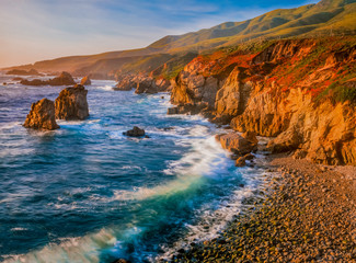The green and orange shoreline of Garrapata State Park is alive with color.
