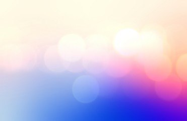 Bokeh abstract pattern on blue pink vivid gradient background. Bright lights blurred texture. 
