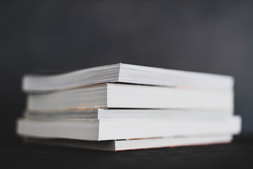 stack of books shot from eye level with shallow depth of field.