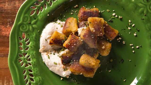 vegan banana gnocchi with white sauce. Top view with smoke.