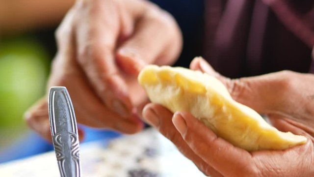 Making manadonese tuna stuffed bread/pastry (panada).  Indonesian version is traditionally filled with a combination of skipjack tuna, onions, coconut milk, chili peppers, and other ingredients.