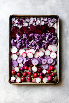 Raw vegetables on a baking tray.