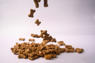 Fototapeta premium Dog Food on white background shoot dog biscuits