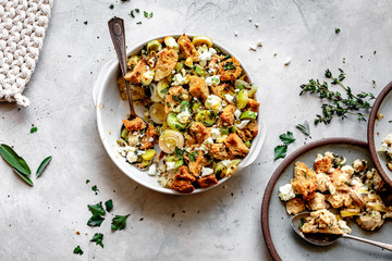 Goat cheese, leek and herb stuffing served onto a plate.