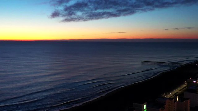 Colorful sunrise over beach aerial