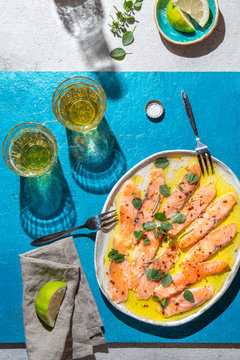 Latin American and Italian dish Crudo de Salmon. Raw Salmon marinated in lemon juice and spices. Top view
