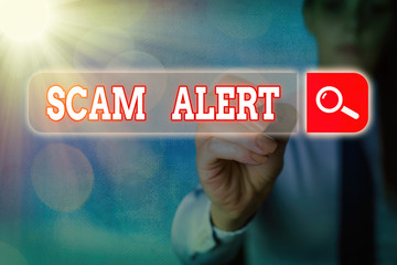 Writing note showing Scam Alert. Business concept for unsolicited email that claims the prospect of...