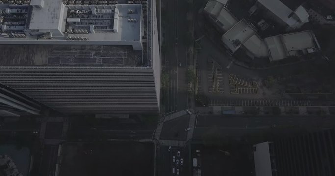Ungraded, Bird's eyes view, Aerial flight over avenue tilting up to reveal urban city. Drone, 4K.