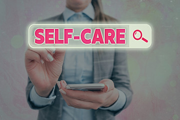 Text sign showing Self Care. Business photo text the practice of taking action to improve one s is...