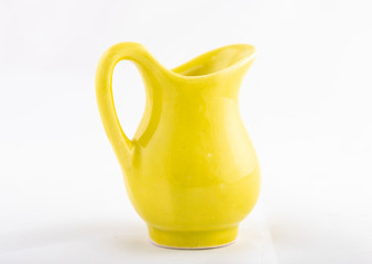 yellow ceramic jug