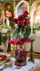 Bouquet of flowers with candles in the church.