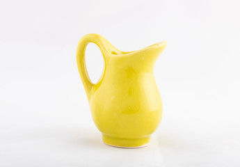 yellow ceramic jug