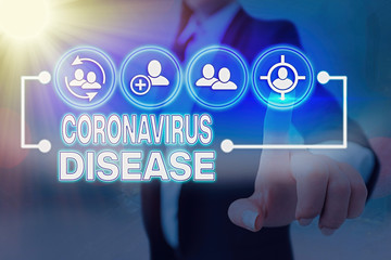 Conceptual hand writing showing Coronavirus Disease. Concept meaning defined as illness caused by a...