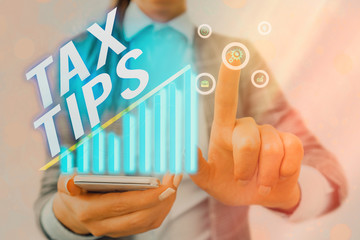 Word writing text Tax Tips. Business photo showcasing compulsory contribution to state revenue...