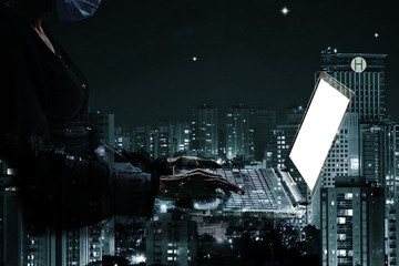 double exposure of a woman wearing a face mask using laptop with city scape, reflection illustration