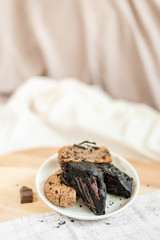 soft dark chocolate brownie cookies on on cutting board