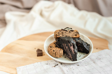 soft dark chocolate brownie cookies on on cutting board