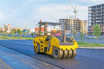 Obraz na płótnie Canvas Heavy machinery for repairing roads at work
