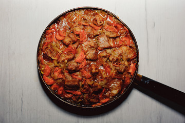 food fried stew meat stew vegetables tasty beautifully close in the pan

