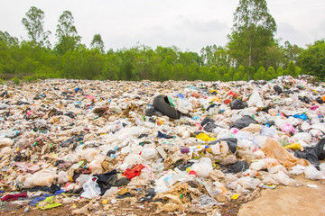garbage dump pile in trash dump or landfill,truck is dumping the gabage from municipal,garbage dump pile , pollution concept