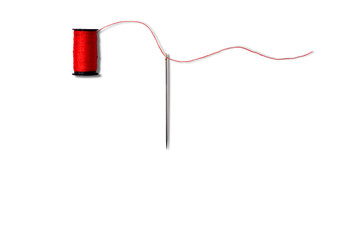 Sewing Needle and Spool Thread isolated on white background.