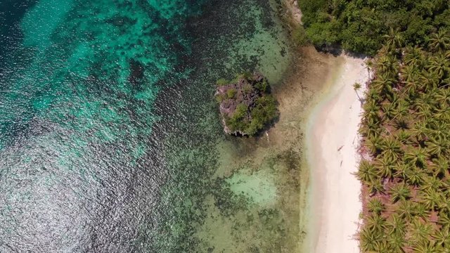 Aerial view, Drone shot of a secret white sand beach and blue water in the Phiilippines. Paradise beach. Secret island view.